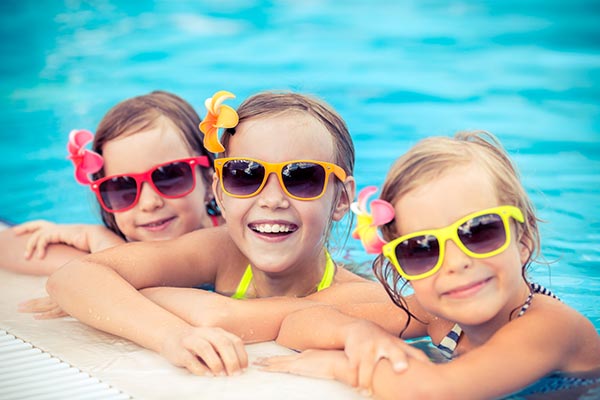 Children's Eczema Care – Happy girls in swimming pool